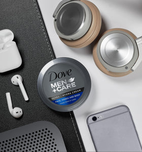 Dove Men+Care tubes on a bathroom shelf in lifestyle scene for daily grooming routine