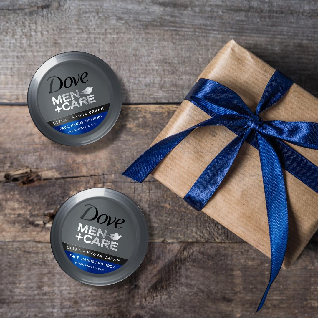 Dove Men+Care tube held in hand for scale, illustrating portable 2.53 oz convenience