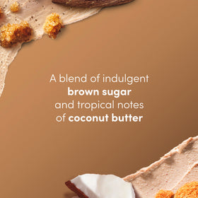 Hand scooping Dove scrub to show easy spread and creamy coverage
