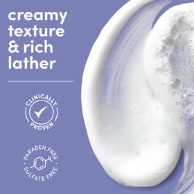 Dove body wash in use on wet skin producing velvety foam and calming scent