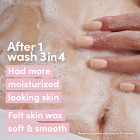 Dove body wash in use under shower stream for refined skin