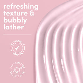 Dove serum texture on hand showing creamy lather and hydration