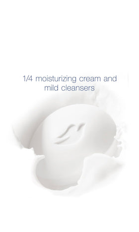 Dove single bar close-up with creamy lather demonstrating gentle cleansing benefit