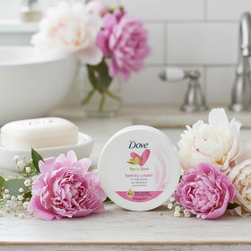 Dove single jar with lid open showing cream and portability benefit