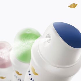 Dove can held in hand for scale showing compact 3.8 oz travel-friendly protection