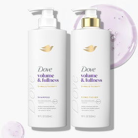 Dove bottles beside a hand to show 18 oz scale and convenience