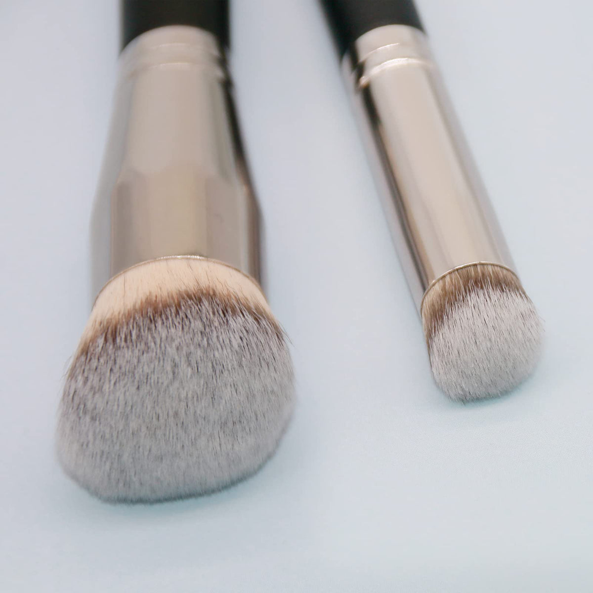 dpolla brushes held in hand for size comparison showing comfortable grip and control