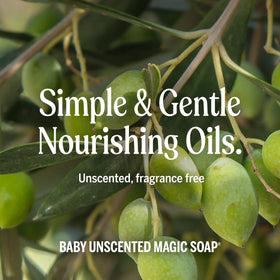 Parent bathing infant with Dr. Bronner's unscented soap demonstrating gentle care