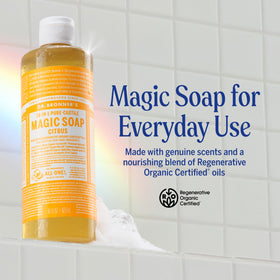 Dr. Bronner's soap pouring into hand with rich lather for effective cleansing