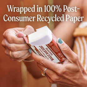 Dr. Bronner's recycled paper wrapper emphasizing eco-friendly packaging benefit