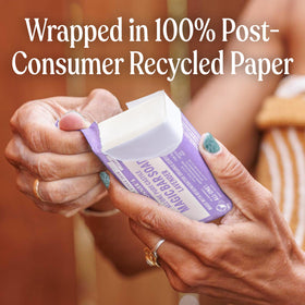 Dr. Bronner's lavender bar on draining soap dish promoting longer-lasting bars