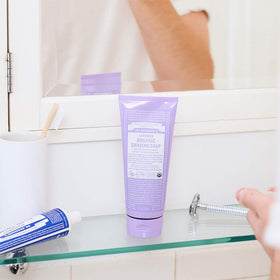 Dr. Bronner's shaving soap with shikakai powder in bowl highlighting natural conditioning