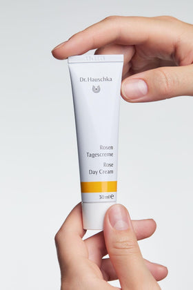 Dr. Hauschka hand applying cream demonstrating gentle absorption