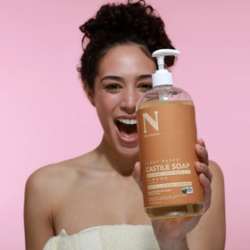 Dr. Natural lathered in hand to show clarifying shampoo performance