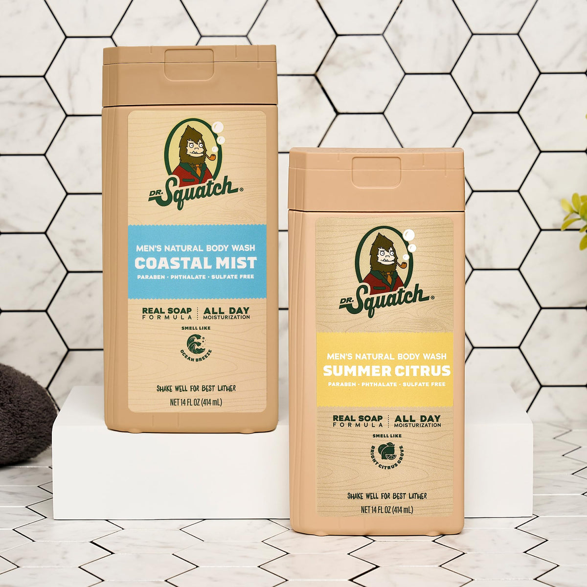 Dr. Squatch bottle beside hand showing 14 oz size for value and travel