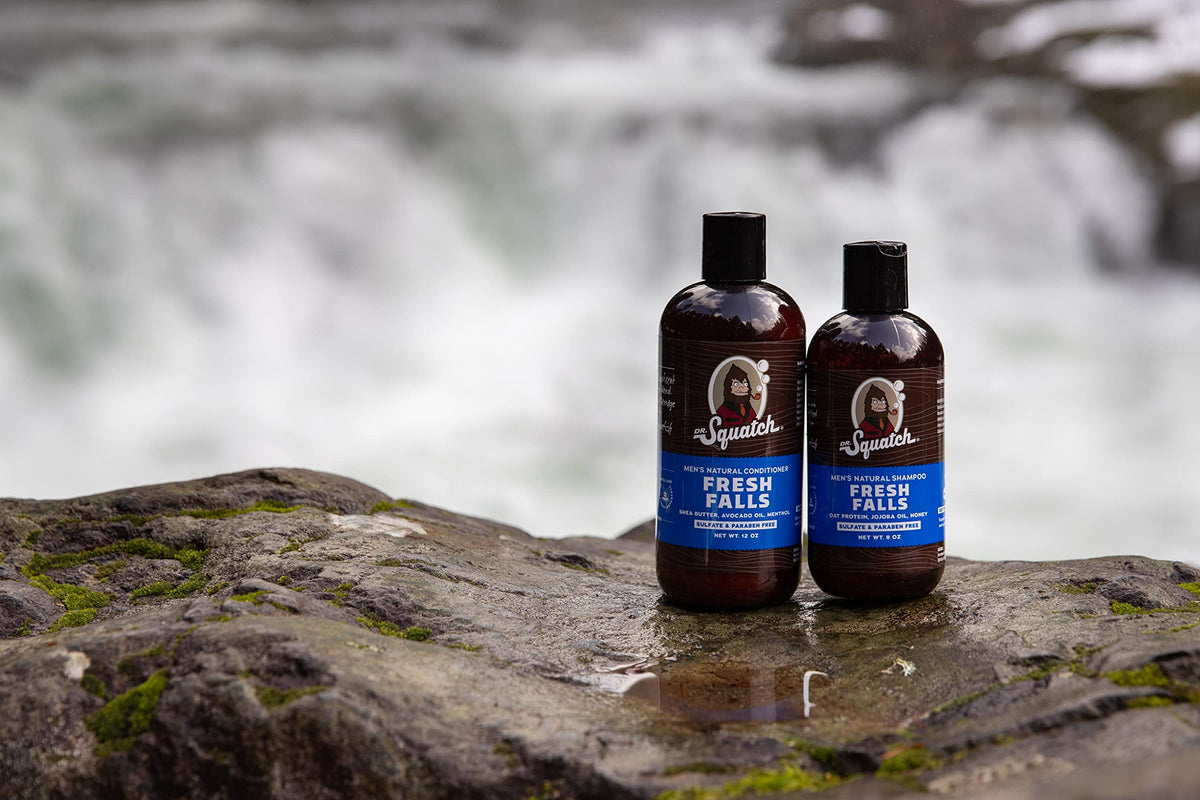 Dr. Squatch next to a hand for size comparison and travel-friendly convenience