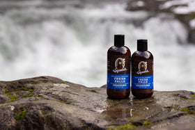 Dr. Squatch next to a hand for size comparison and travel-friendly convenience