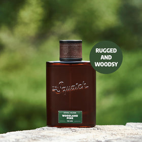 Dr. Squatch spraying cologne demonstrating easy application and lasting fragrance benefit