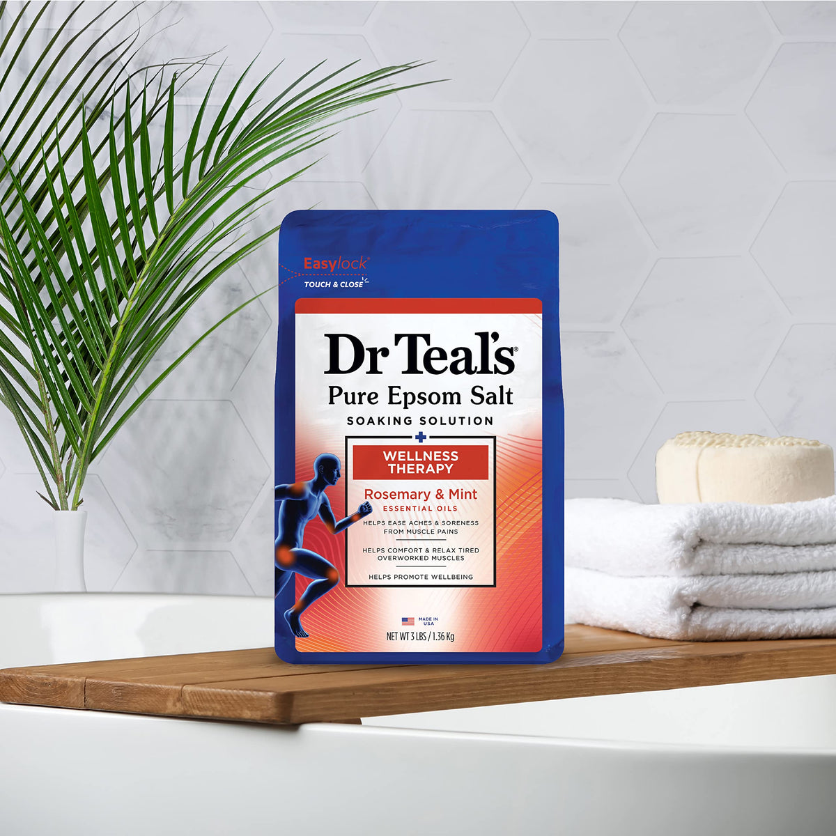 Person enjoying a Dr Teal's bath in a serene bathroom, benefit of relaxation