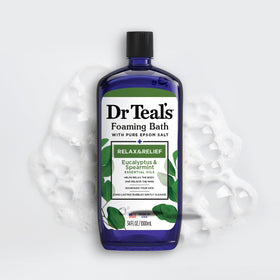 Dr Teal's bottle staged with towel and candle to show calming self-care benefit