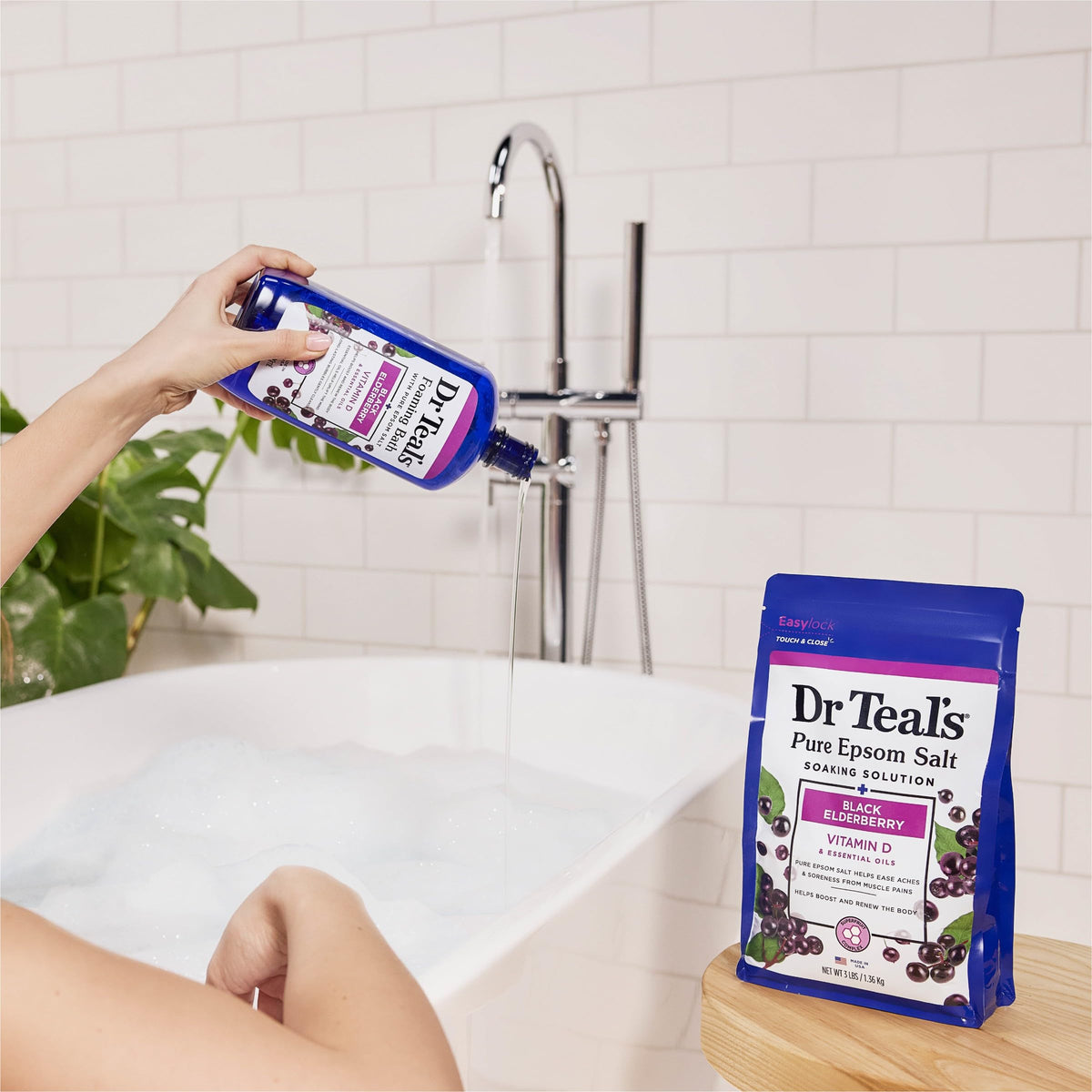 Dr Teal's bottle beside towel showing 34 fl oz scale and value benefit