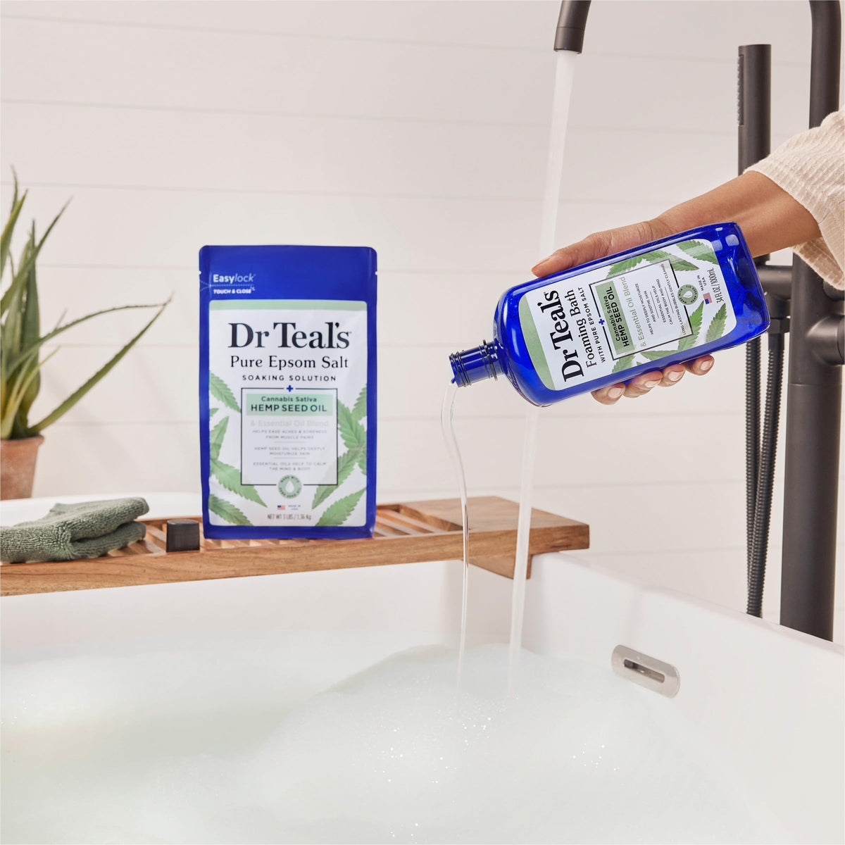 Dr Teal's bottle held in hand to show size and easy pour control benefit