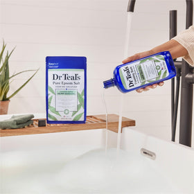 Dr Teal's bottle held in hand to show size and easy pour control benefit