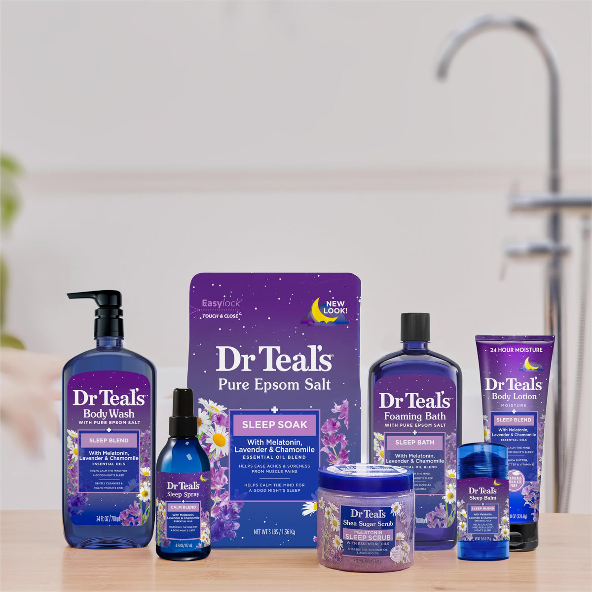 Bottles of Dr Teal's with lavender and chamomile essential oils nearby