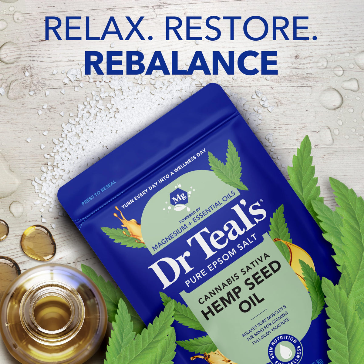Bottle of hemp seed oil beside Dr Teal's salt illustrating nourishing blend