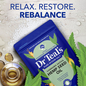 Bottle of hemp seed oil beside Dr Teal's salt illustrating nourishing blend