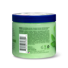 Dr Teal's scoop of scrub on finger showing easy application and control