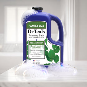 Dr Teal's 62.5 fl oz bottle shown next to common household items for scale