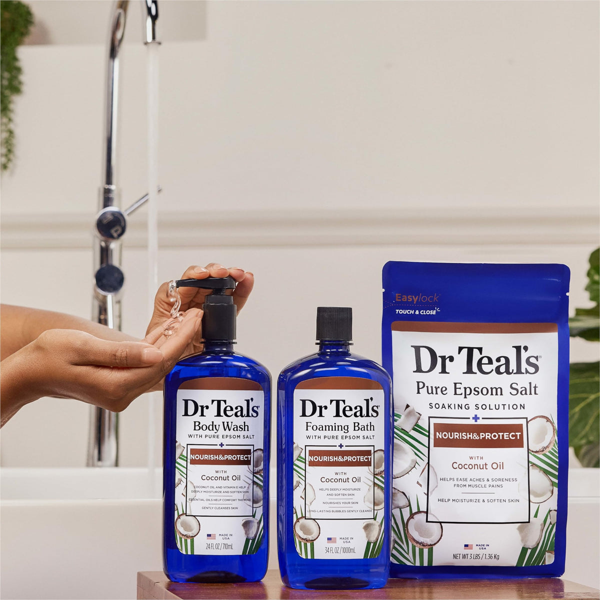 Dr Teal's bottle held in hand illustrating 24 fl oz scale