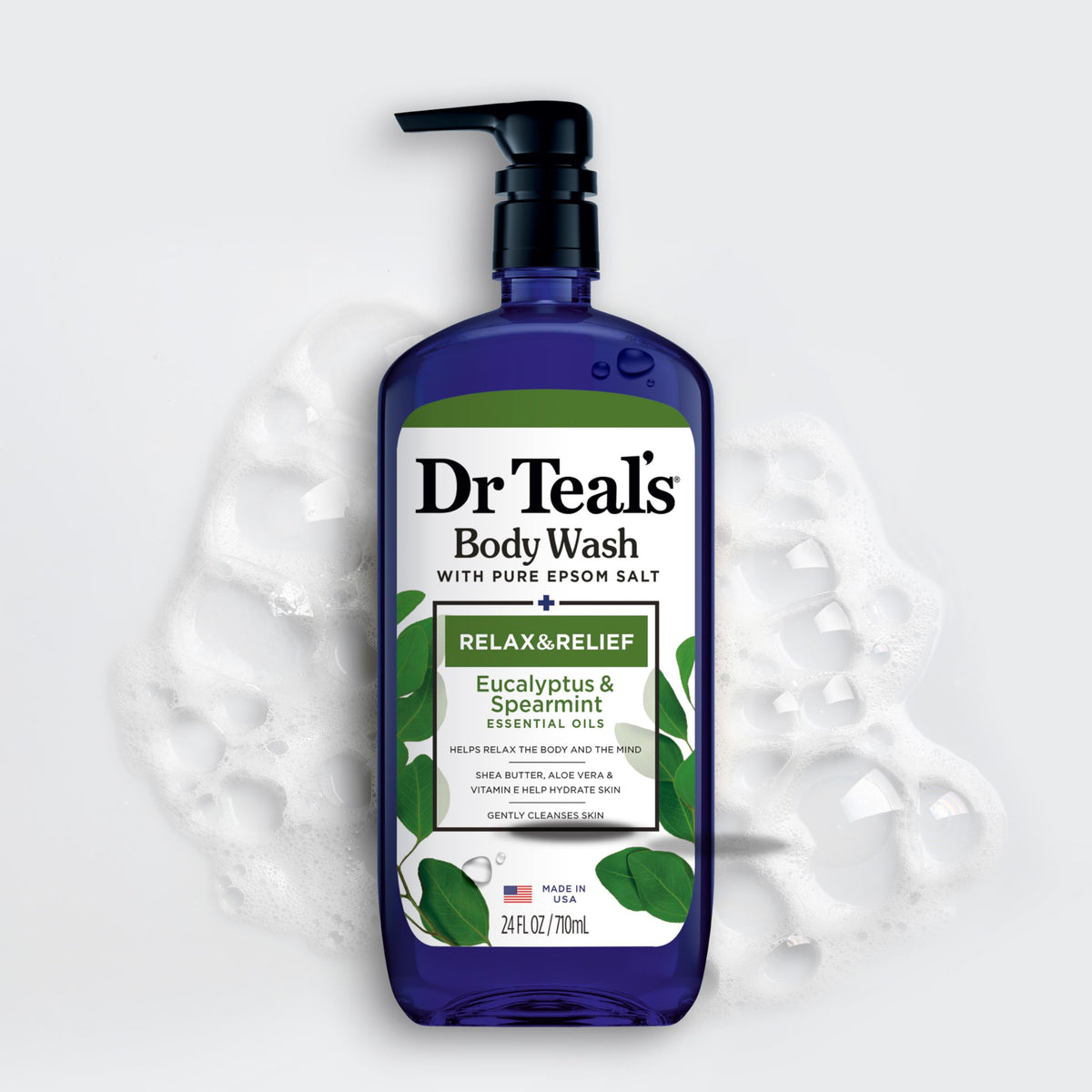 Dr Teal's bottle held in hand to show true 24 fl oz size