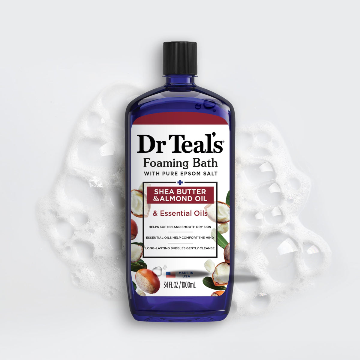 Dr Teal's 34 fl oz bottle next to a hand to show product scale