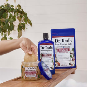 Dr Teal's scrub on vanity with towel suggesting daily ritual nourishment