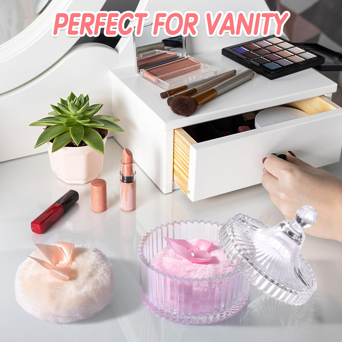 Draupnir puff held in hand to show size and easy control for full-body dusting
