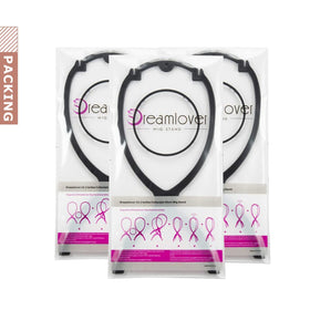 Dreamlover hand holding folded stand showing compact size and travel convenience