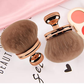 DRIPOO brush in travel flatlay showing compact kit benefit for on-the-go use