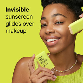 Dr.Jart+ sunscreen stick placed beside makeup bag for easy on-the-go touch-ups