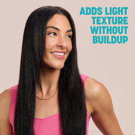 Drybar can in hand showing 3.8 oz travel-friendly size benefit