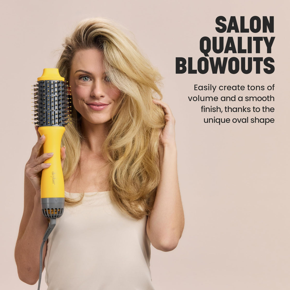 Drybar Double Shot horizontal at crown creating visible root lift and volume