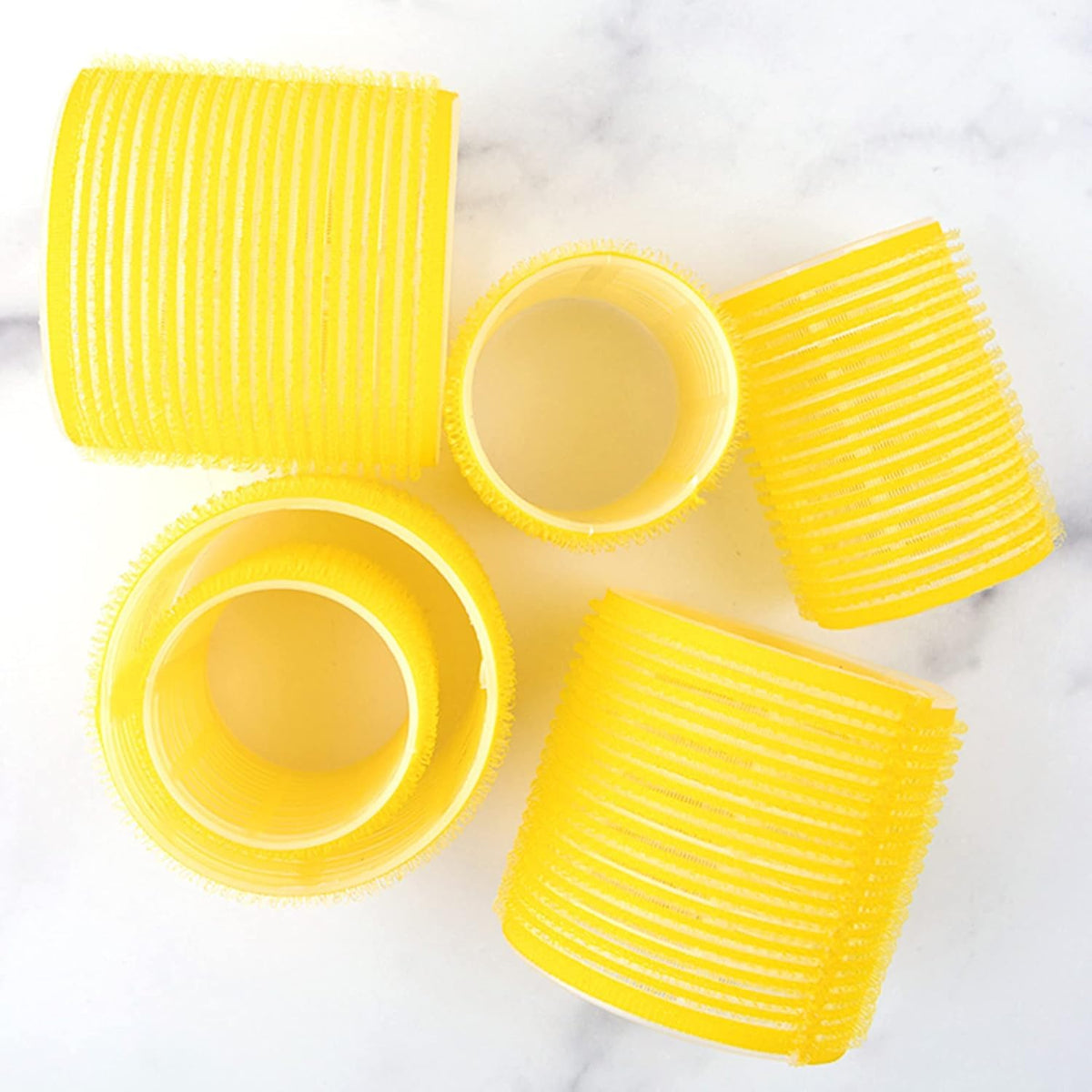 Drybar High Tops rollers in hair creating lifted crown volume and shape
