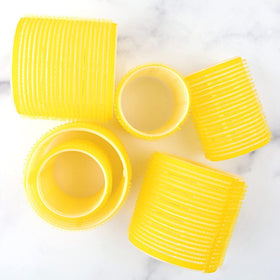 Drybar High Tops rollers in hair creating lifted crown volume and shape