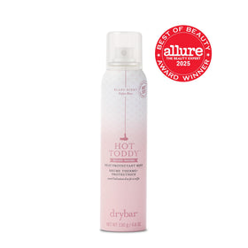 Drybar Hot Toddy bottle beside marula oil and rice grains highlighting strengthening benefit