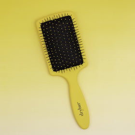 Drybar Lemon Bar brushing extensions gently to prevent pulling and protect bonds