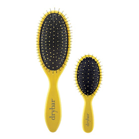 Drybar Lil' Lemon Drop brushing extensions gently to protect bonds and reduce pulling