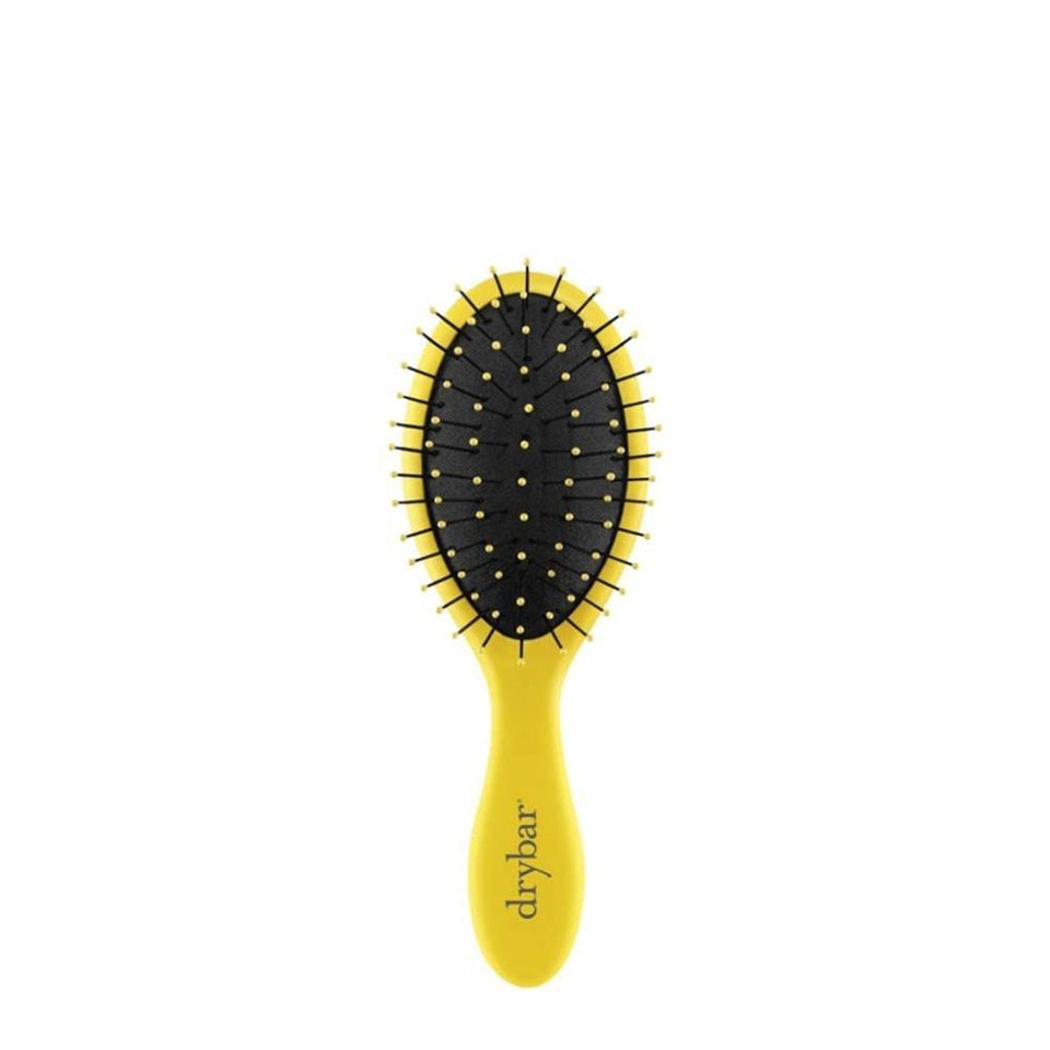 Drybar Lil' Lemon Drop front view showing compact travel-friendly design and easy grip
