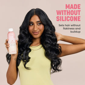 Drybar held in hand to show size and portability for daily styling