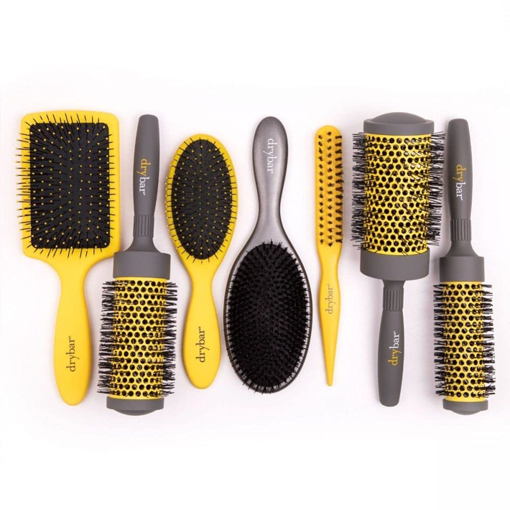 Drybar Super Lemon Drop on bathroom counter in lifestyle scene promoting faster, smoother blowouts